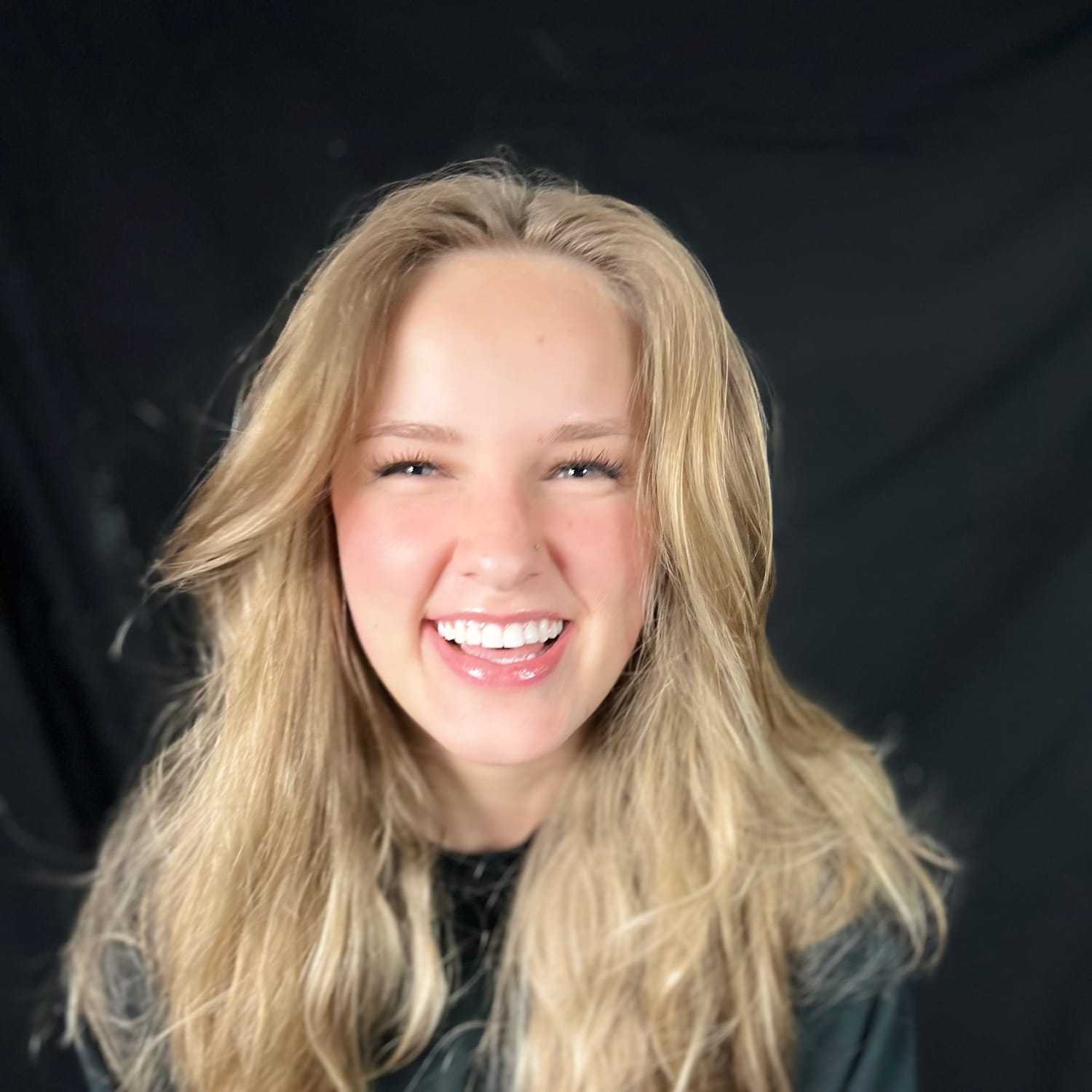 Portrait of MEAGAN MANN, a professional stylist at KAYCE + CO, showcasing their expertise and style.