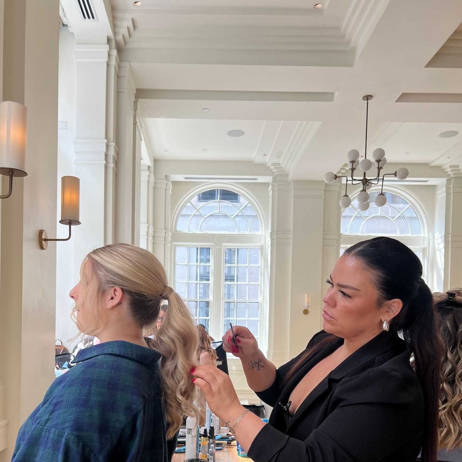 Portrait of KAYCE DENTON WALL, a professional stylist at KAYCE + CO, showcasing their expertise and style.