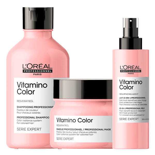 Three L'Oréal Vitamino Color hair care products including shampoo, mask, and spray.